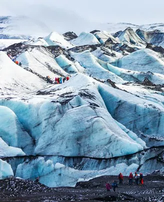 Des randonneurs sur le glacier Solheimajokull